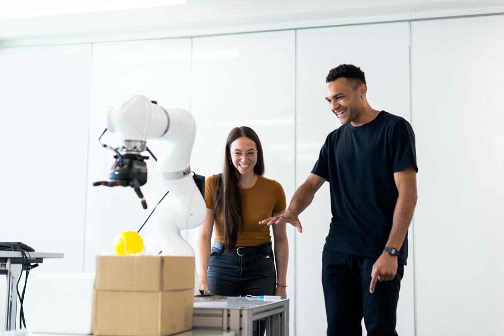 Two engineers test a robotic arm in a lab, illustrating the hands-on nature of edge AI development. The specialized skills of AI Edge Engineers command premium salaries. Industry analyses show that as of 2025, even mid-level AI Edge specialists often earn $85,000 to $140,000 annually on average in the U.S.​ byteplus.com , with higher variations depending on the factors below. Senior professionals who lead projects or teams can see salaries well into six figures, sometimes crossing the $200,000 mark when bonuses and stock are included​ linkedin.com . In short, AI Edge Engineering has become a high-paying career due to the scarcity of talent and the critical importance of the role.