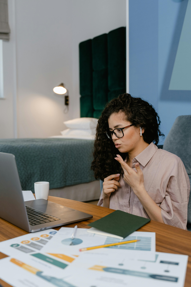 A remote data engineer connects with her team via video call, illustrating how collaborative work can happen from home.